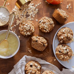 Freshly baked sourdough apple muffins. With a bowl of applesauce and oatmeal.
